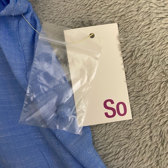 a blue t-shirt with buttons - Picture 4 of 4